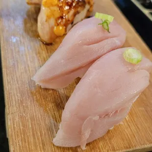 Seared salmon nigiri &amp; hamachi nigiri.