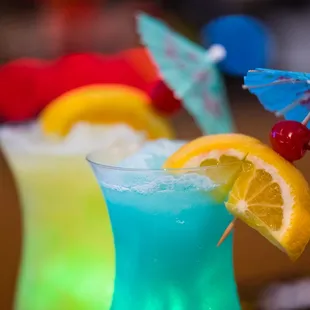 two cocktails with umbrellas