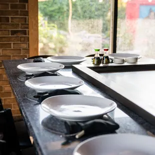 a row of plates on a counter