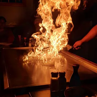 a flame coming out of the grill