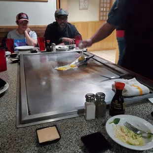 a group of people sitting at a table