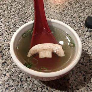 a bowl of soup with a spoon in it
