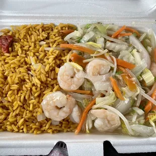 shrimp and rice in a styrofoam container
