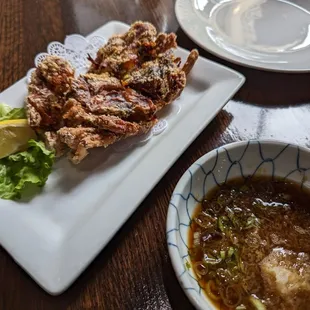 Soft shell crab with sauce on the side.