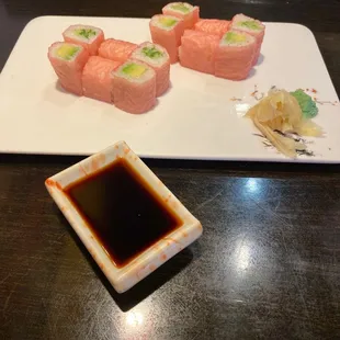 a plate of sushi and sauce