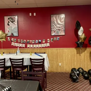 a dining room with balloons and balloons