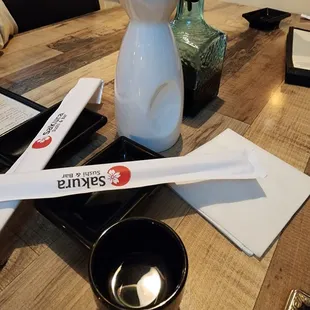 a wooden table with utensils on it