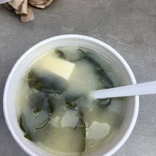 a bowl of soup with a spoon in it