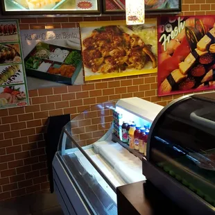 a sushi and sashimi display in a restaurant