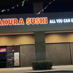 the front of a restaurant at night