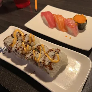two plates of different types of sushi