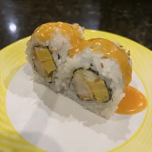 Roll off the train -- shrimp tempura and maybe mango?