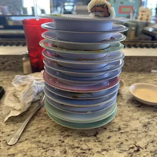 a stack of plates on a counter