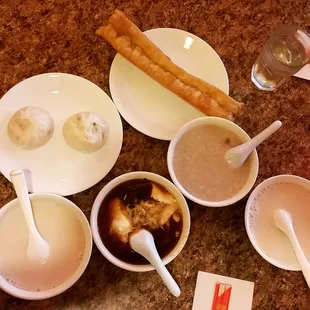 Brunch: soy milk, jellied bean curd (豆腐腦), chicken and thousand year old egg congee (肉粥), pork buns, and fried dough (油條). Total $14.18