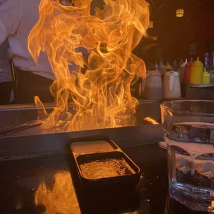 a flame coming out of a frying pan