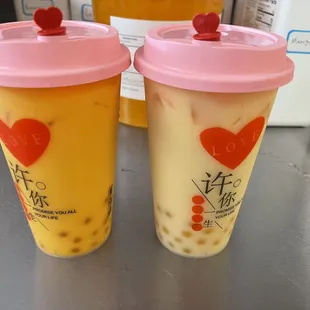 two cups of bubble tea on a table
