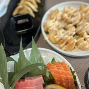 Pot stickers, Sashimi lunch plate, and coconut shrimp  AMAZING