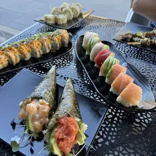 Spicy scallop and spicy tuna hand roll / rainbow roll / summer roll / California roll
