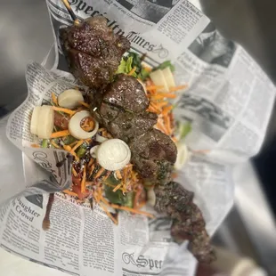 a meat skewer in a wrapper