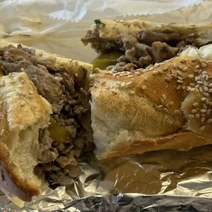 Cheesesteak w hot peppers - delicious fresh seeded roll - meat was sliced and so so. Needed a bit more cheese mixed in.