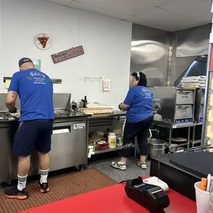 Crafting my Sicilian Sub to the right. I can't believe the owner cranks out so many pizzas in the small ovens to the far right.