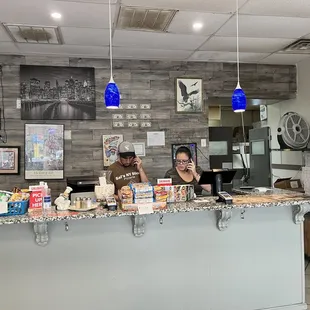two people sitting at a counter
