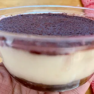 a hand holding a dessert