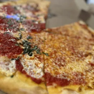 1/2 margarita and 1/2 cheese pizza