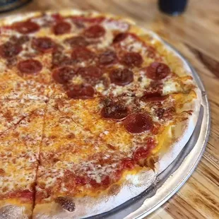 A whole pie half cheese, the other half pepperoni and bacon.