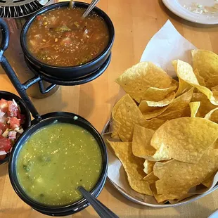 Chips and 3 kinds of salsa.