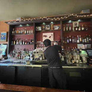 a bartender at the bar