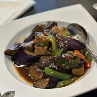 a plate of stir fried vegetables
