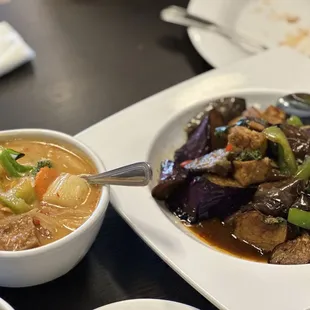 a bowl of soup and a bowl of vegetables