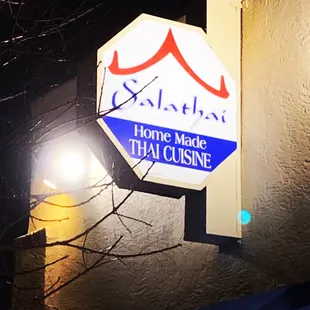 a sign for a thai cuisine restaurant