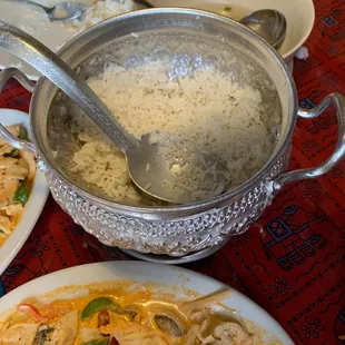 a bowl of rice and a bowl of chicken and vegetables