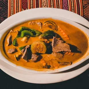 a bowl of beef and vegetable soup