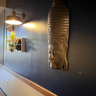 a buddha head on the wall