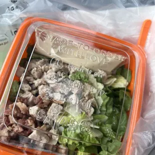 Cesar salad with added chicken and bacon