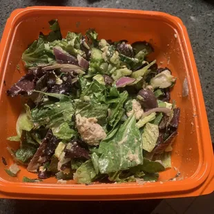 Greek salad &amp; mixed w/ Greek dressing. It settled a bit due to the weight of the dressing but the bowl was nice and full pre-mix.