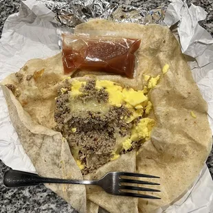 Egg, sausage and cheese breakfast burrito.