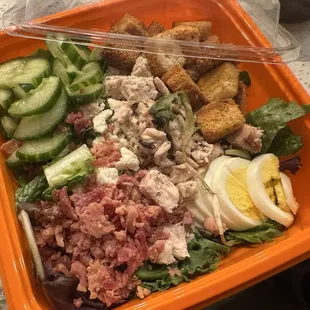 Cobb with chicken, swapped out blue cheese, avocado, tomato for cucumber, croutons, and ranch dressing instead of blue cheese.