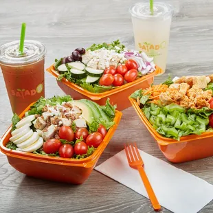 a variety of salads and drinks