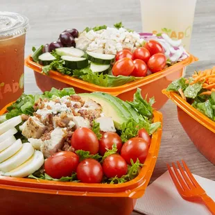 a variety of salads and drinks