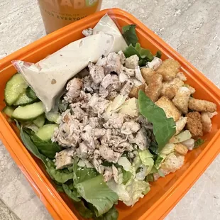 Chicken Caesar salad with cucumbers and a mango green tea