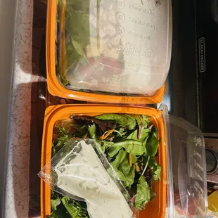 I have no clue what's in this photo. It doesn't look like an avocado wrap and buffalo chicken salad to me. Does it look like one to you?