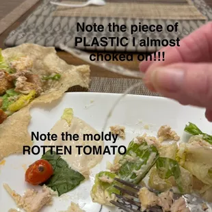 Rotten tomatoes and plastic strip found in the wrap