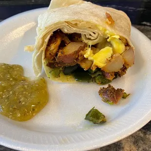 Egg, cheese, potato and poblano peppers.     Salsa Verde salsa that is made by salad and go.