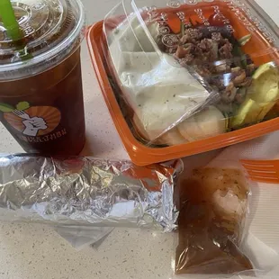 Cobb salad, iced coffee, and breakfast burrito.