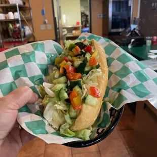 Hippy Love Hoagie-hummus, Greek dressing, artichoke hearts, cucumbers, romaine, bell peppers, red onion, olives (dairy or vegan cheese)