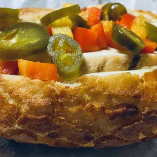 Teacher's Pet Hoagie!  Chicken, Bacon, Provolone, Onion, Jalapeños, Bell peppers and spicy Greek dressing on a crunch roll!